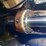 Maintenance free bearing installed on hitch pitch location on a CAT 793D